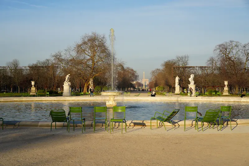 Fountain and green chairs in the Tuileries Garden