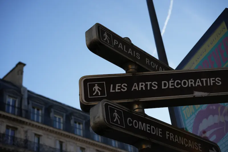 Signposts to museums and theaters in Paris